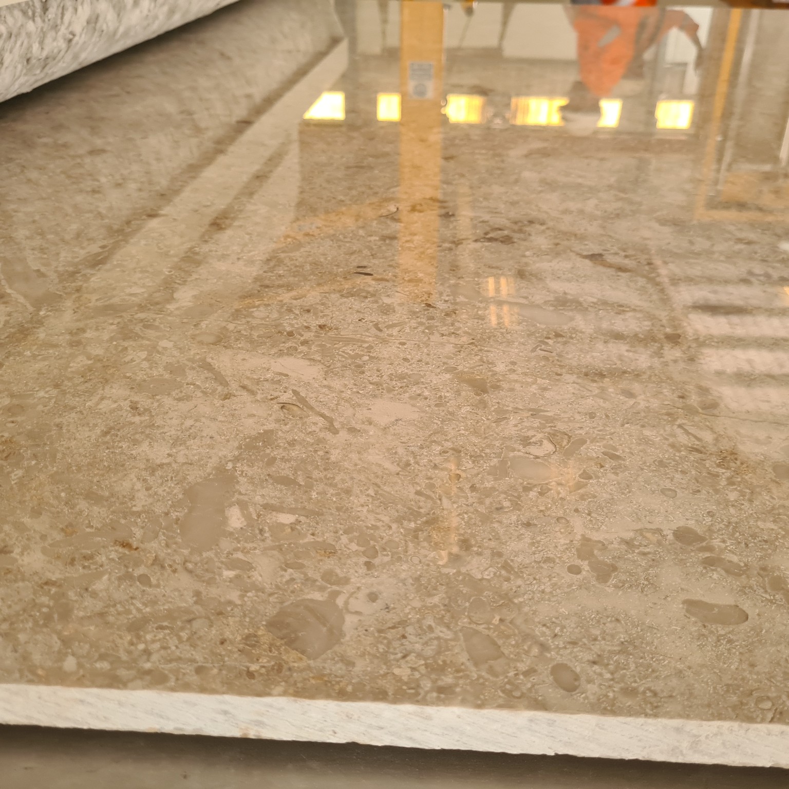 High-gloss polished natural stone slab surface